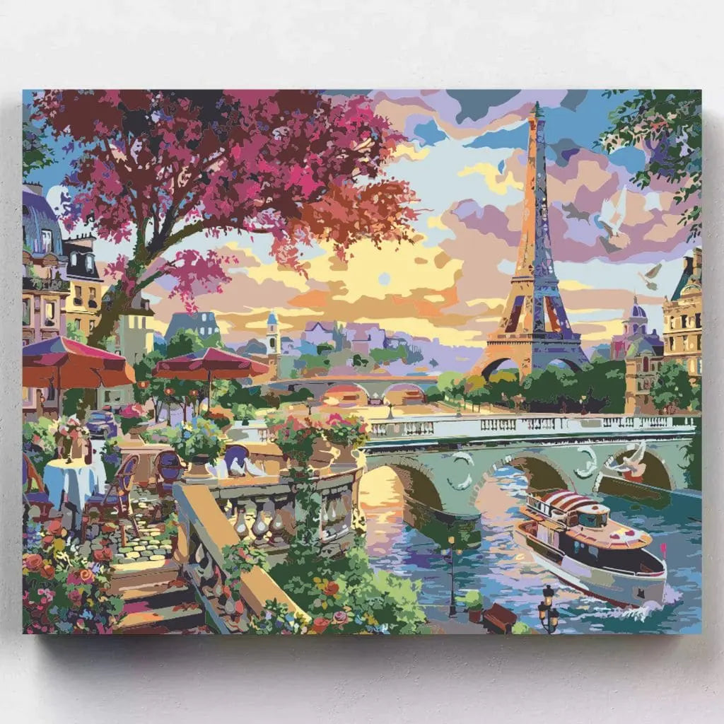 DIY Malen nach Zahlen – romantischer Pariser Abend mit Eiffelturm, Seine, Brücke, Caféterrasse und Boot bei Sonnenuntergang auf Leinwand - nur bei Artyroom-shop